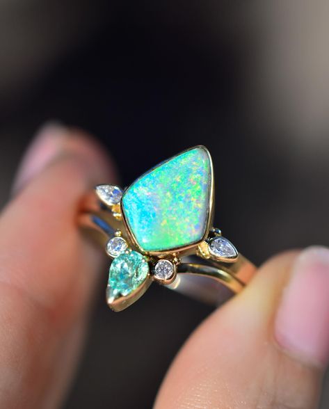 I’m loving how this new Minty Australian Opal Ring Set Came out! It’s paired with minty tourmaline and natural diamonds, set in 14k yellow gold. What are you seeing/feeling with this one? Can you see the rainbow colors in the opal in the video? Australian Opal Ring, Opal Engagement Ring, Australian Boulder Opal, Opal Engagement, Engagement Rings Opal, Opal Ring, Australian Opal, Boulder Opal, Opal Rings