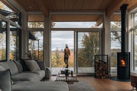 Are Wood Stoves and Big Windows Still the Stuff That Dreams Are Made of? Wood Stove In Front Of Window, Modern Woodstoves, Wood Stoves Ideas Living Rooms, Big Windows Living Room, Maine Cabin, Cottage Fireplace, Nature Living, Cowboy Ranch, Fire Places