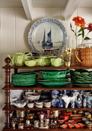 An interior designer's New England beach house serves as a backdrop for his impressive collection New England Beach, Island Cottage, New England Beach House, Wooden Mantle, England Beaches, Custom Chair, Hanging Plates, New York Apartment, Armchair Vintage