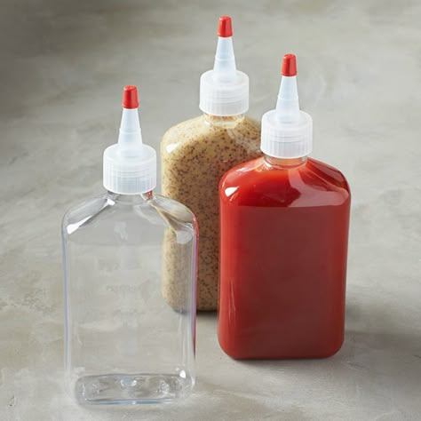 Remember those old-fashioned red and yellow condiment squeeze bottles from forever ago? Well, now you can forgo being locked into boring ketchup and mustard and add any condiment, salad dressing, or marinade you like inside these much fancier and beautifully transparent Reusable Condiment Squeeze Bottles. Banana Sauce, Kitchen 101, Restaurant Kitchen Equipment, Cookware Set Best, Kitchen Organization Pantry, Kitchenware Store, Fancy Food, Food Board, Squeeze Bottles