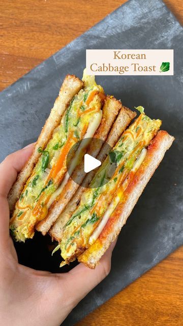 872K views · 28K likes | Guntas Sethi on Instagram: "✨Korean Cabbage Toast✨

A good breakfast sets the mood for the day, and this Korean Cabbage Toast, famously known as “Gilgeori Toast” in Korea which basically means street toast, does just that🤌🏽 !

It’s packed with protein, a crunch from the cabbage, and cheese between slices of buttery toasted bread. It’s the salty and sweet taste from the unusual condiment combination that will make you swoon. 🥰🥪

Recipe : 
- 1/2 Cabbage 
- 1 Onion 
- Bunch of Spring Onions
- 1 Carrot
- 2 eggs 
- Salt and Pepper

- 1 tsp sugar 
- 1 slice of cheese 
- Ketchup & mustard 

#breakfastideas #Koreanfood #GilgeoriToast #foodie #delicious #toastlover #foodbloggers #homemade #healthybreakfast #streetfood #korean

[Korean breakfast, Cabbage toast recipe, Br Korean Egg Cabbage Sandwich, Korean Egg Breakfast, Cabbage And Eggs Recipes, Breakfast Cabbage, Cabbage And Cheese, Korean Sandwich, Korean Cabbage, Egg And Bread Recipes, Korean Vegetarian