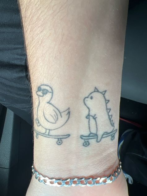 Duck On Skateboard Tattoo, Matching Tattoos Mother Daughter Funny, Opposite Couple Tattoos, Tiny Rubber Duck Tattoo, Matching Tattoos Animals, Matching Ghost Tattoos For Couples, Matching Duck Tattoo, Skateboard Tattoo, Partner Tattoos