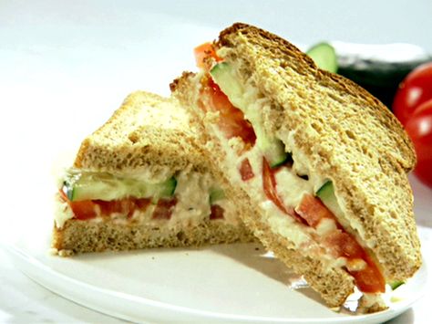 Cucumber and Tomato Sandwich with Garlic White Bean Hummus from FoodNetwork.com Basil Mayonnaise Recipe, Hummus And Cucumber, Special Sandwiches, White Bean Hummus Recipe, Bean Hummus Recipe, Lunch Dishes, Lemon Hummus, Cucumber Sandwich, Cucumber And Tomato