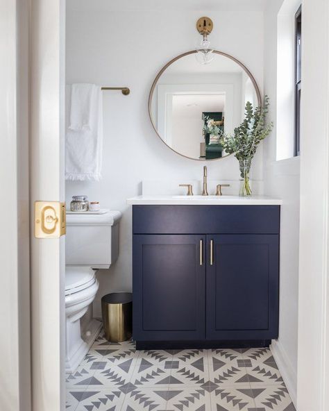 navy blue bathroom cabinets in boho bathroom with patterned tile and white countertop credit: Kimberlee Marie Small Guest Bathroom Ideas Half Baths, Scandinavian Bathroom Design Ideas, Small Guest Bathroom Ideas, Modern Powder Rooms, Navy Blue Bathrooms, Blue Cabinet, Blue Bathroom Vanity, Powder Room Vanity, Bilik Air