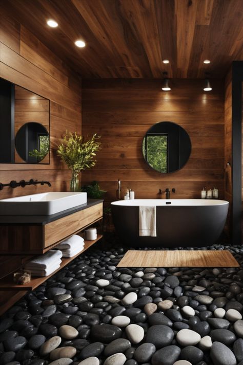 Find your zen in this nature-inspired bathroom featuring dark cedar walls and a mesmerizing black river rock floor. Where outdoor beauty meets indoor luxury. #NaturalDesign #CedarWood #SpaLike Bathroom Black Feature Wall, Cedar Bathroom, River Rock Floor, River Rock Shower, Bathroom Design Wood, Black River Rock, Zen Bathrooms, Nature Inspired Bathroom, Japanese Bathroom Design