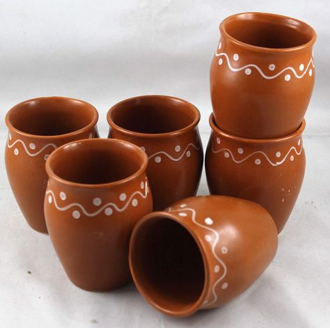 About this item
Hand crafted by rural artisans of Puri,Odisha
Color - Brown
Capacity - 160 ml each; Size in Inches ( Dia x H ) - 2 x 3
Set contents - 6 Ceramic cups
Care instructions : Wash with normal detergent by hand Holi Ideas, Hot Chai Tea, Indian Chai Tea, Indian Ceramics, Indian Chai, Mexican Party Decorations, Indian Home Design, Dinning Set, Pottery Painting Designs