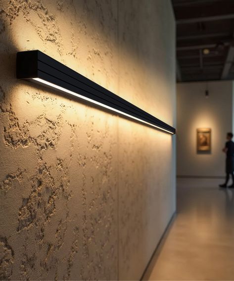 The 3.75-inch linear wall light comes with an extruded aluminum housing finished in a durable powder coat. Designed for continuous runs of up to 40 feet at 120V and 100 feet at 277V, the wall light features a regressed lens to reduce glare, delivering 450 to 900 lumens in full downlight mode and 500 to 1,000 lumens in a 50/50% uplight and downlight setting. The fixture includes a 7-position DIP switch for directional lighting, CCT adjustable settings (3000K, 3500K, 4000K), 0-10V dimming and optional emergency backup. Damp location rated for outdoor use under cover. Wall Washer Lights, Uplighting Interior, Lighting Plan Interior, Indirect Lighting Ceiling, Hanging Bar Lights, Wall Washer Lighting, Recessed Linear Lighting, Led Cove Lighting, Led Linear Lighting