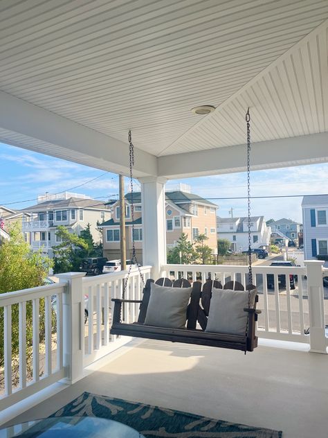 home inspo, home decor, summer house, hanging bench, beach house, LBI, NJ, porch decor, porch inspo, blue ans white carpet, bench with pillows, glass table, beach haven, white fence, white, blue, coastal grandmother, blue and white aesthetic, beach decor, summer, beach vibes, summer vibes, summer 2023, july, august, july 2023, august 2023, coastal granddaughter Wrap Around Porch Coastal, Tsitp Beach House Aesthetic, Hydrangea Beach House, Lbi Beach House, Costal Granddaughter Aesthic Living Room, Costal Aesthetic House, Blue Beach House Aesthetic, Coastal Granddaughter Lifestyle, Coastal Grandma House Aesthetic