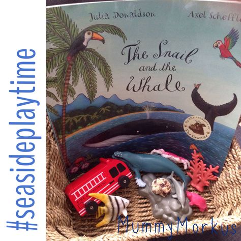 Storytelling basket for The Snail and the Whale by Julia Donaldson and Axel Scheffler. Used a shell in place of a snail, plastic animals which feature in some of the visited places and a fire engine. Perfect to use alongside the story or independently for imaginative play. Story Telling Basket, The Snail And The Whale Activities Eyfs, Storytelling Basket, Snail And The Whale Activities, Snail Kindergarten Activities, Literacy Provocations, Whale Activities, The Snail And The Whale, Memoir Of A Snail