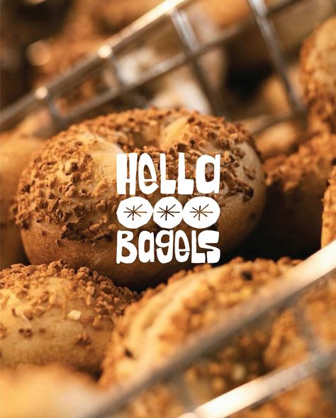 Hella Bagels is a bagel shop that embraces a community-first approach, crafting hand-rolled bagels baked fresh every day for the lucky locals in the Bay Area, California. I had the opportunity to develop their brand identity, focusing on bold abstract shapes with a handmade, tactile feel. This new visual presence, complemented by a diverse illustration pack, is designed to be highly adaptable across digital and print applications, ensuring that Hella Bagels’ cohesive identity supports its gr... Diverse Illustration, Bagel Branding, Bagel Board, New York Bagel, Bagel Shop, Future Shop, Bay Area California, Ads Design, Inspiration Logo