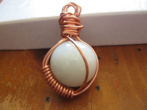 copper wire wrapped pearl marble pendant by Katlynmanson.deviantart.com on @deviantART Marble Crafts, Wire Wrapped Pearl, Wire Jewerly, Colored Marble, Marbles Crafts, Copper Wire Art, Pendant Ideas, Wire Wrapped Stone Jewelry, Copper Design