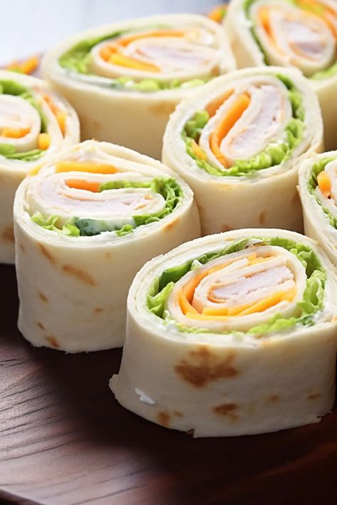 Turkey Cheddar Lunch Roll Ups - That Oven Feelin Turkey Ranch Roll Ups, Southwest Chicken Roll Ups, Snack Roll Ups, Turkey Pinwheels Recipes, Lunch Tortilla Ideas, Turkey Roll Ups Tortilla, Wrap Roll Ups, Lunch Ideas With Tortillas, Roll Up Wraps