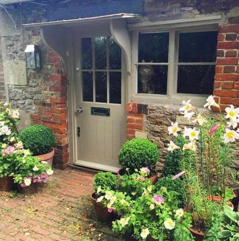 The Hatch | Location House Wiltshire | Beach Studios English Bungalow Exterior, Cottage Entryway Exterior, Country Cottage Front Doors, English Country Cottage Garden, Modern Garden Planting, English Country Cottage Exterior, Wood Door Exterior, Cottage Revival, French Farmhouse Design