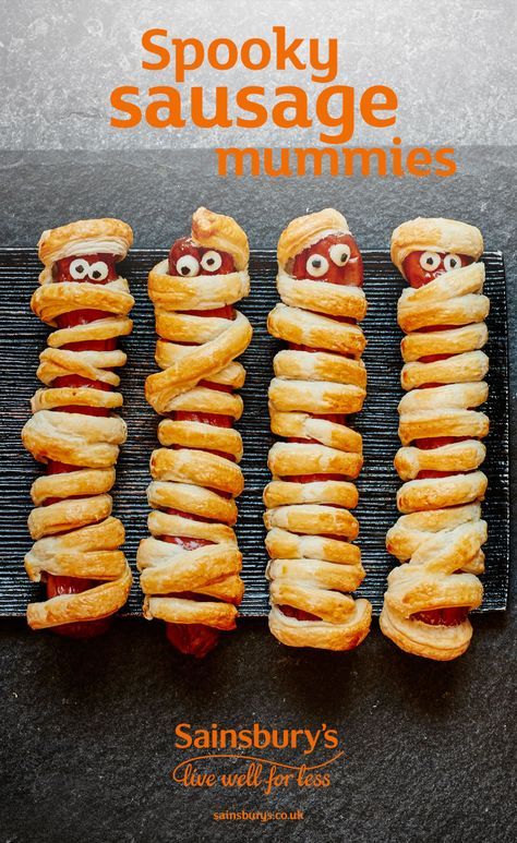 These spooky sausage rolls are an easy treat to make for your Halloween party - ready in 30 minutes and they can be eaten hot or cold. Serve with ketchup or sweet chilli sauce for a ‘bloody’ dip Hallowe’en Treats, Halloween Sausage Ideas, Sausage Halloween Food, Halloween Baking Savoury, Halloween Sausage Rolls, Kids Halloween Tea Party, Halloween Sweet Treats For Kids, Halloween Tea Party Food, Halloween Tea Party Ideas