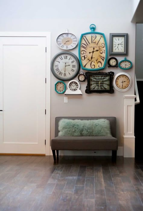 Clock Collage Wall - such a fun way to fill a wall!  From www.overthebigmoon.com Clock Collage, Casa Disney, Relaxing Decor, Entrance Wall, Colors Wall, Clock Wall, Front Entrance, Cool Coffee Tables, Family Wall