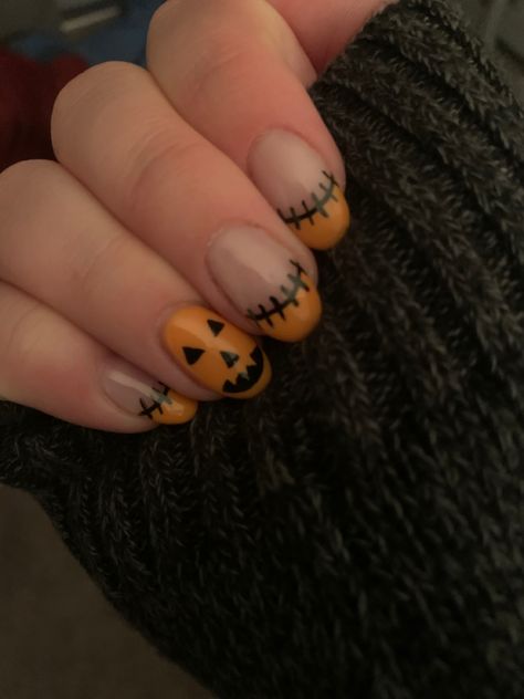 Cute orange French tip Frankenstein nails and a jack-o’-lantern on the ring finger. Halloween Nail Pumpkin, Nail Designs Halloween Fall Short, Easy Pumpkin Nail Art, Nails Almond Halloween, Halloween Nails Easy Simple, Jackolantern Nails, Silly Nails, Easy Fall Nail Designs, Nail Inspired