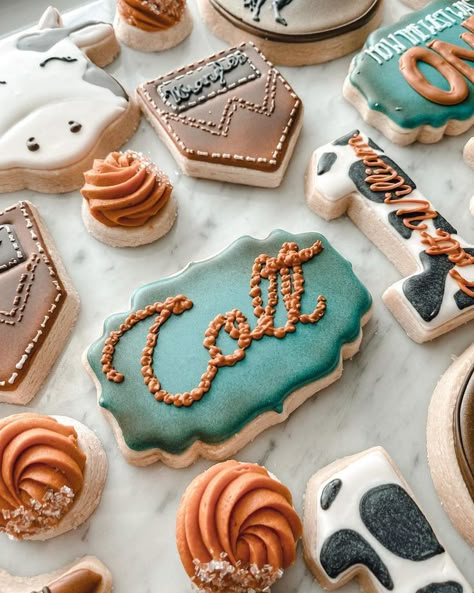 Platter of custom design cookies for a FIrst Birthday decorated in a cowboy theme.  Shapes include, cows head, the number one with cow print decor, back pocket chap cookie.  Custom design cookies in Northern Kentucky. Cowboy Theme Cookies, Cookies Cowboy, Cowboy Birthday Party Decorations, Cowboy First Birthday, Cowboy Themed Birthday Party, Cow Cookies, First Birthday Cookies, Theme Cookies, Western Birthday Party