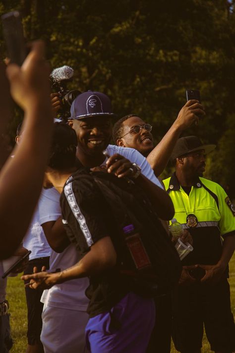 Two black men embrace in a brotherly hug as another man lifts his phone with a half smile on his face to record something. In the foreground of the image, another hand with a phone is lifted, and the head of a camera peeks above the two hugging men. Black Cookout, Men Smiling, Music Soul, Half Smile, Things To Do In Boston, To Do In Boston, Boston Art, I Love Being Black, Vision Board Photos