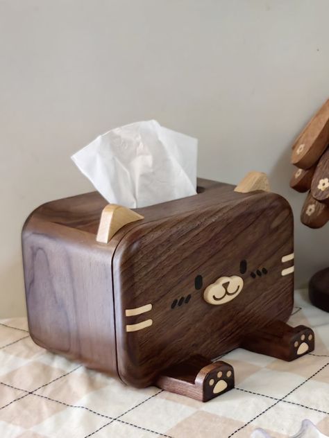 Add a playful touch to your home decor with our Exquisite solid wood cat face tissue box. The cat's legs act as a fun mobile phone holder, while the sturdy wood construction is perfect for your tissues. A quirky and creative addition to any room. Meow! Material:Black WanlutSize:19cm(L)*(13.5+4.5cm(W))*14cm(H) (1 inch=2.54cm) Wood Cat, Tissue Box Holder, Tissue Holder, Mobile Phone Holder, Tissue Box, Cat Face, Tissue Holders, Creative Home, Wood Construction