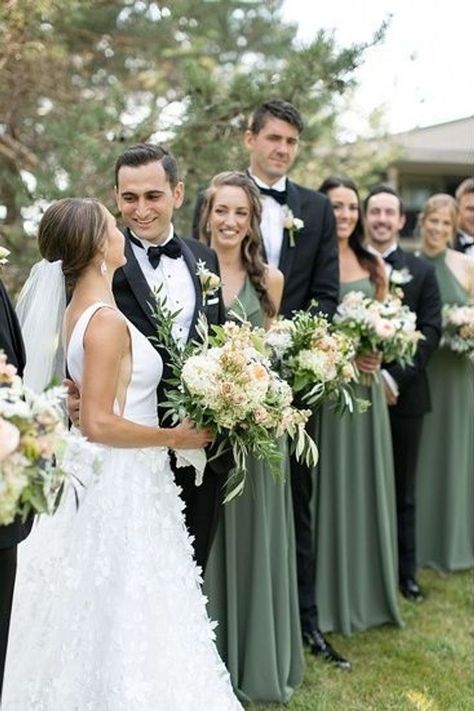 Bridal Party With Green Dresses, Outdoor Wedding Bridal Party, Dark Sage Wedding Theme, Black Tuxedo Wedding With Sage Green, Eucalyptus Wedding Party Colors, Black Suit Sage Green Dress, Green Bridesmaids With Groomsmen, Sage Wedding Party Attire, Sage Green And Black Wedding Bridesmaid Dress