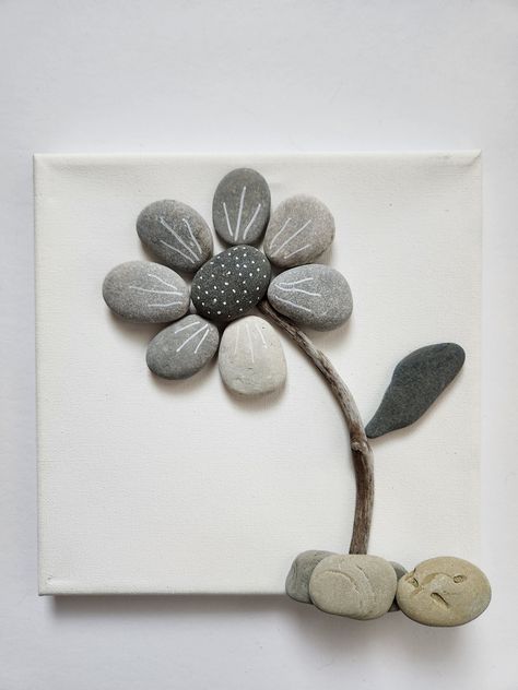 These dainty little black, gray, and white flowers will bring happiness to any room! Lakeshore Rock Art handpicks each rock from the shores of Lake Michigan.  And since no two rocks are the same, we can GUARANTEE that your Rock Art is 100% UNIQUE!  Because of this uniqueness, your final product will look slightly different than the photo above. We do our best to make it as close as possible to the original. Have an idea you would like to see transformed into Rock Art?  Send us a message and we w River Rock Art Pebble Mosaic, Framed Rock Art Ideas, Rock Stacking Art, Flower Pebble Art Ideas, Stone Crafts Diy Rock Art, Shadow Box Rock Art, Diy Rock Decor, Rock Mosaic Art, Rock Crafts For Adults Diy Projects