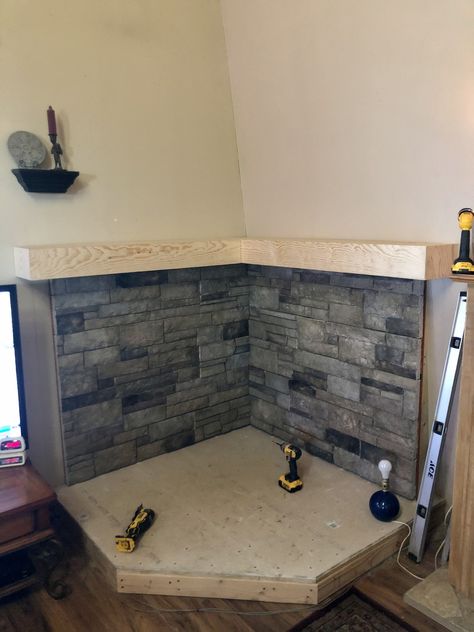 Pellet Stove Platform, Faux Stone Fireplace Wall, Corner Wood Burning Stove Ideas, Pellet Stove Ideas Living Rooms, Wood Burning Stove Corner, Corner Wood Stove, Wood Stove Surround, Faux Stone Fireplaces, Corner Fireplaces