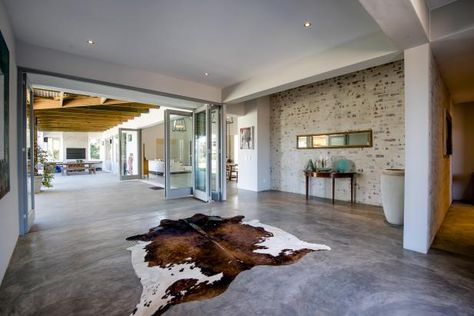 The Pros and Cons of Concrete Flooring | HGTV Cement Floors In House, Cleaning Concrete Floors, Concrete Floors Living Room, Finished Concrete Floors, Seal Concrete Floor, Concrete Floors In House, Heated Concrete Floor, Interior Concrete Floors, Acid Stained Concrete Floors