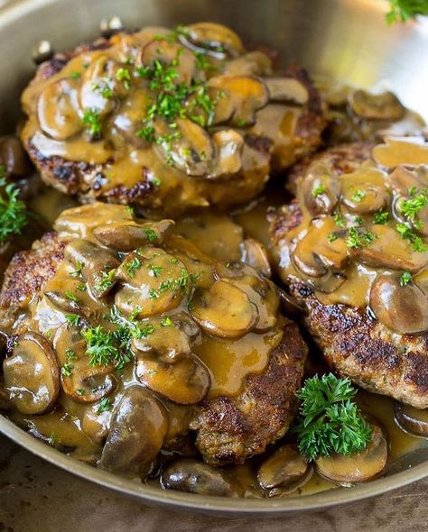 Hamburger Steak with Mushroom Gravy This recipe is seasoned ground beef patties simmered in a savory mushroom sauce. A comfort food classic… Burger Patty Dinner Ideas, Hamburger With Mushroom Gravy, Chopped Hamburger Steak, Hamburger And Mushroom Recipes, Hamburger And Mushrooms, Hamberg Recipes, Burger Patty Meal Ideas, Burger Patty Recipe Beef, Chop Steak Recipe