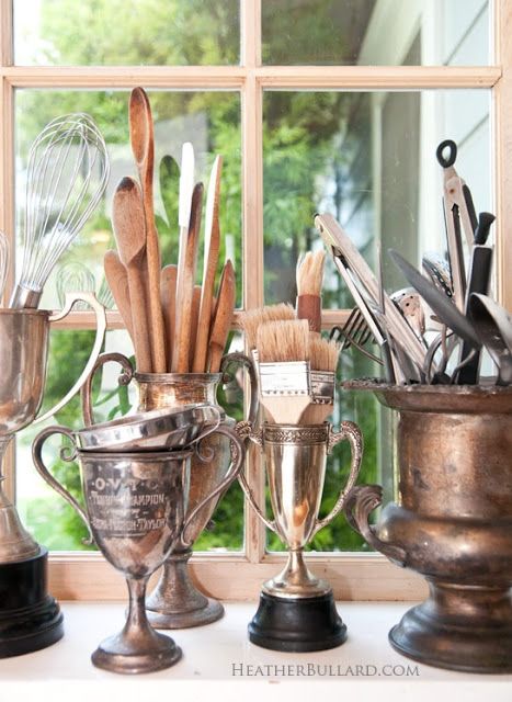 Repurpose vintage silver urns and vases into kitchen utensil holders Old Trophies, Kitchen Utensil Organization, Trophy Cup, Utensil Storage, Diy Kitchen Storage, Champagne Buckets, Utensil Holder, The Design Files, Diy Kitchen