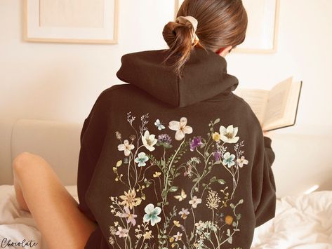 This Gender-Neutral Adult Hoodies item by PoohBearCo has 780 favorites from Etsy shoppers. Ships from United States. Listed on 14 Mar, 2023 Unique Sweatshirt Designs, Hoodie With Flowers, Painting On Hoodies, Hoodies Inspiration, Hoodie Painting, Cottagecore Hoodie, Embroidery Outfits, Painted Hoodie, Pastel Wildflowers