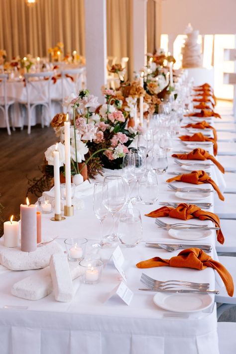 Stunning and elegantly put together - this table styling for the head table is perfection! Sun burnt orange - who knew! 😍
Photography 📸 Love and Other Photography Wedding Table Decorations Burnt Orange, Burnt Orange Table Runner Wedding, White And Burnt Orange Wedding, White And Burnt Orange Wedding Table, Boho Burnt Orange Wedding Table, White Gold Orange Wedding Table Settings, Burnt Orange Cheesecloth Table Runner, Linen Tablecloth Wedding, Bramleigh Estate