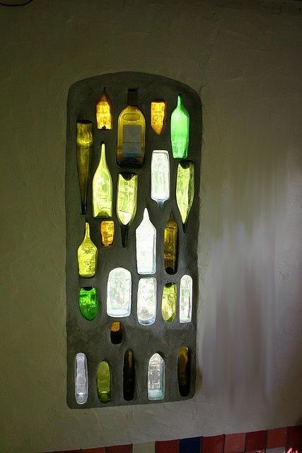 That is so cool! A wine bottle stained glass window. Will have to ask the glass people in my life about this-wonder if you could just make a panel to stand in the yard to catch the sun's rays? Ideas Recicladas, Bottle Window, Earthship Home, Bottle Wall, Cob House, Earth Homes, Natural Building, Earthship, Backyard Fences