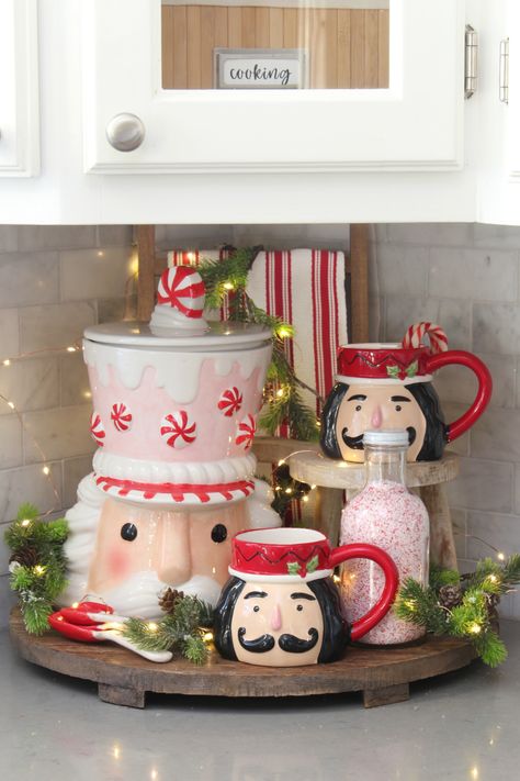 Join in this Christmas home tour with this nutcracker inspired Christmas kitchen decor.  Fun and festive ways to decorate your kitchen for the holidays! Christmas Decor Ideas For Living Room Nutcracker, Mixer Christmas Decor, Nutcracker Storage Ideas, Gingerbread Theme Kitchen Decor, Nutcracker Kitchen Decor, Christmas Mug Decor, Gingerbread Cookie Jar, Kitchen Bar Christmas Decor, Nutcracker Table Setting