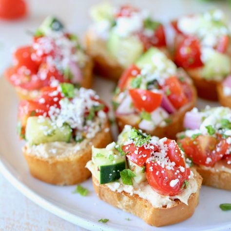 Greek Bruschetta Recipe with Tomatoes & Feta - WhitneyBond.com Greek Bruschetta, Bruchetta Appetizers, Cheese Bruschetta, Easy Bruschetta Recipe, Mediterranean Appetizers, Spring Appetizers, Easy Bruschetta, Tomato Bruschetta, Fresh Cherry