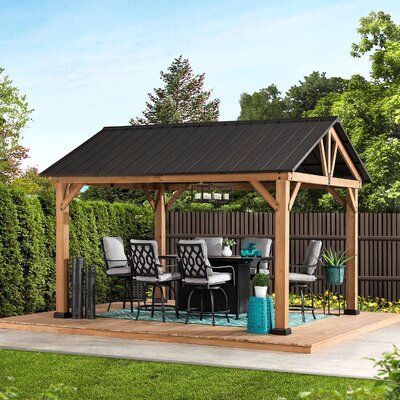 null Expand your living space by bringing the indoors outside and creating your end-of-the-day oasis that’s the perfect spot for entertaining family and friends. This 12 ft. x 10 ft. gazebo by the world’s leading ready-to-assemble outdoor structure maker, Sunjoy, creates the perfect outdoor setting for any time of the year. Spend all four seasons enjoying a covered spot outdoors under the Cedar wood frame with a sturdy rust-resistant powder-coated steel roof top that will stand the test of time. Entrance Landscaping, Garden Shelter, Gable Roof Design, Cedar Roof, Outdoor Structure, Backyard Shade, Driveway Entrance, Steel Roof, Wooden Gazebo