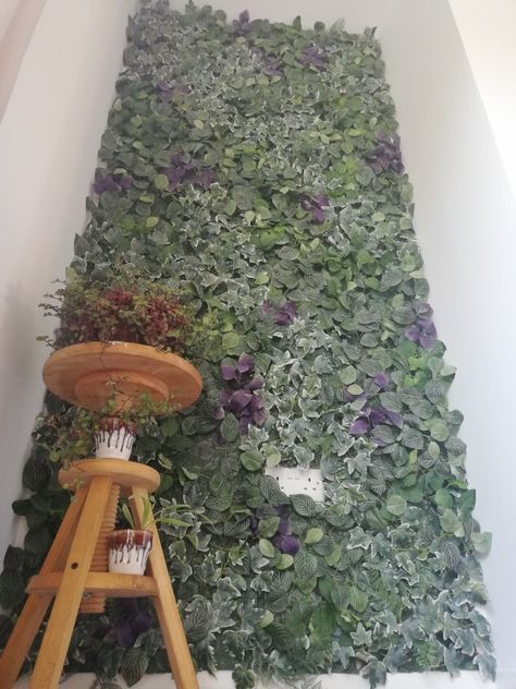 IKEA living wall green and purple and a cheeky little creeping inch to boot #ikea #fejka #livingwall #creepinginch #diy #babs Ikea Plant Wall Hack, Ikea Fejka Wall Ideas, Fejka Ikea Ideas, Fake Greenery Wall Paint, Fejka Ikea Wall, Ikea Artificial Plants Wall, Faux Ivy Bedroom Wall, Ikea Plant Wall Fejka, Fake Plant Wall With Neon Sign