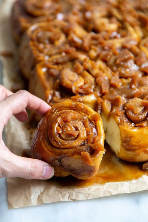 Toffee Sticky Buns. These warm and fluffy buns are filled with cinnamon sugar, coated with a sweet molasses glaze, and topped with chopped toffee bits! #breakfast #brunch #holidays #toffee #stickybuns Molasses Glaze, Savory Holiday Recipes, Sweet Roll Recipe, Homemade Toffee, Sweet Breakfast Treats, Baked Rolls, Sweet Buns, Breakfast Sweets, Toffee Bits