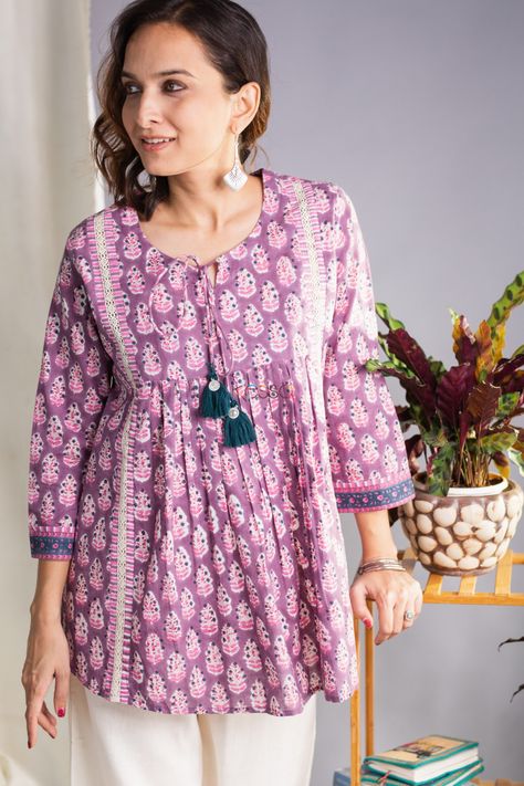 Sanjita cotton hand block printed fabric in hues of pastel shades, this short kurti is enhanced with front pleats. Perfect for casual Fridays at work, this short kurti can transition effortlessly from a work look to a casual look. Versatile and very comfy comes with front tussel and 3/4th sleeve. Pair this with our Cotton Salwar for perfect look. Short Cotton Frock For Women, Short Cotton Kurti, Cotton Kurti Design, Kurti Design Ideas, Cotton Short Kurti, Simple Dress For Girl, Short Kurti Designs, Cotton Short Tops, Cotton Frock