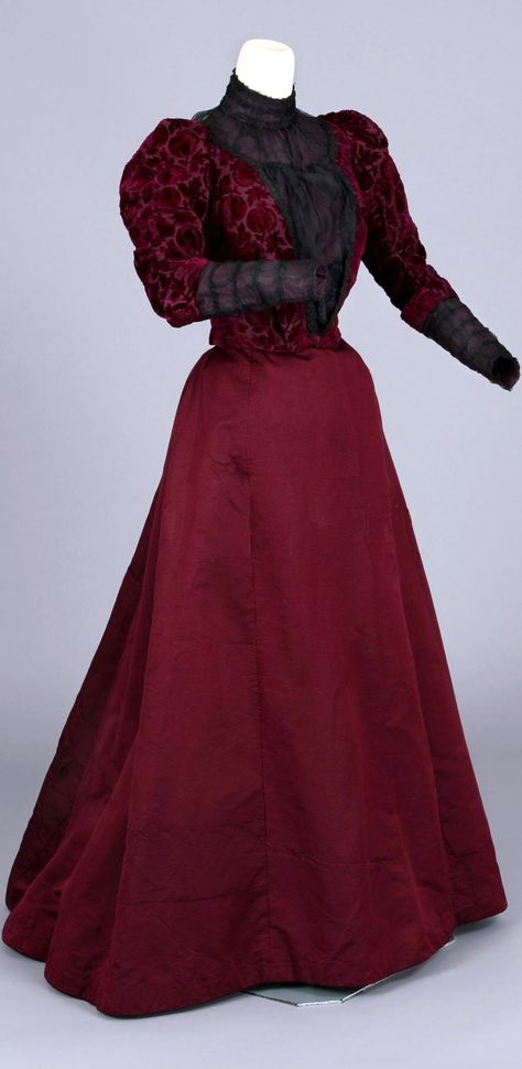 Dress, two pieces, circa 1896. Voided velvet, black chiffon, purple. Striking voided velvet pattern with pomegranate design. Skirt is ribbed silk and bodice has gathered black chiffon cuffs, puffed sleeves, and pigeon breasted-blouse front that would persist in popularity into the early 1900s. Via Chester County (PA) Historical Society. 1890 Fashion, Dress Two Pieces, 1900 Fashion, Pomegranate Design, 1890s Fashion, Velvet Pattern, Design Skirt, 1900s Fashion, 1800s Fashion