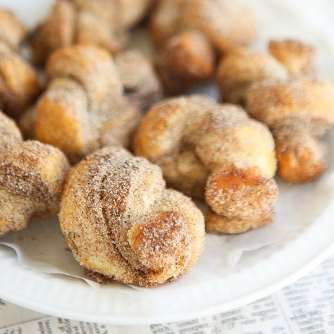 Every fall when the weather cools down, chai somehow makes its way into my baking regimen. Chai has a way of taking ordinary cinnamon based recipes to the next level of wonderful, and this recipe for Spicy Chai Knots makes those warm fall flavors come to life. These twisted little bundles taste so much like churros that I was tempted to name this recipe differently. I settled on Spicy Chai Knots as these golden puff pastry bundles are baked and not fried like churros are. Use cinnamon sugar t... Puff Pastry Bundles, Homemade Chai, High Tea Party, Flavored Sugar, Fall Flavors, Chai Spice, Pastry Sheets, Breakfast Bake, Autumn Flavors