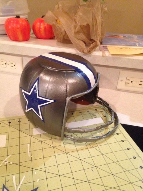 Made this Helmet inspired by the milk jug helmet. I made this out of a plastic pumpkin pail. My son's head was too big for the milk jug. #helmet #Halloween #cowboys Football Helmet Pumpkin, Diy Football Helmet Costume, Diy Football Helmet, Fantasy Football Party, Vbs Diy, Toddler Football, Super Bowl Decorations, Pumpkin Pail, Office Halloween Decorations