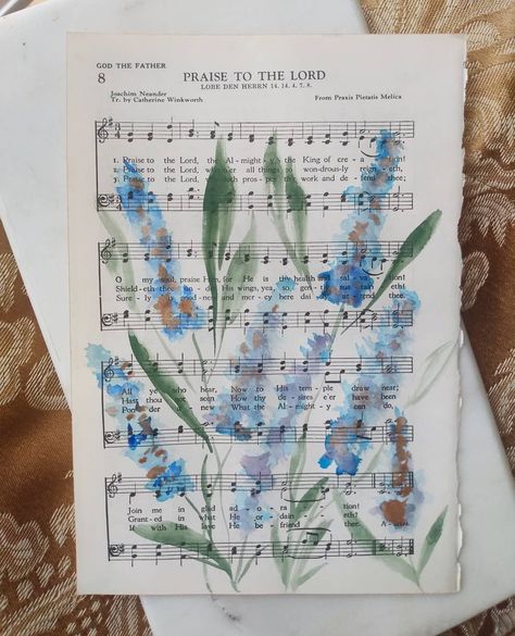 Kimberly Campbell on Instagram: “Happy Sunday! This is day whatever of the hymn art project. This is one of four going to a sweet mama. She wanted blues to match the…” Hymn Art Diy, Sheet Music Art Diy Craft Ideas, Painted Hymnal Pages, Watercolor Hymn Art, Diy Scripture Art, Bible Art Projects, Aesthetic Sheet Music, Hymn Artwork, Hymn Crafts