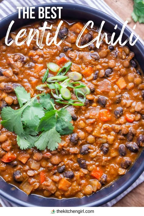 image of lentil chili garnished with cilantro and green onion in black bowl. Top text overlay: The Best Lentil Chilli. Bottom brand overlay: thekitchengirl.com with colored logo Low Fodmap Lentil Chili, Slow Cooker Lentil Chili, Lentil Chili Recipe Crockpot, Black Bean And Lentil Chili, Vegan Gluten Free Chili Recipe, Lentils In Pressure Cooker, Lentil Taco Chili, Chili Lentil Recipe, Yummy Lentil Recipes