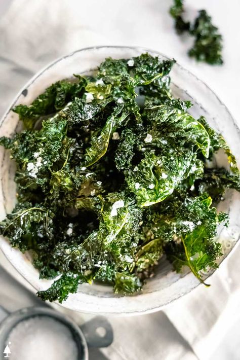 This kale chips recipe adds a crispy element to many a dish or a healthy alternative to the classic potato chip. Salt + delish! #kalechips #lowcarbkalechips Kale Chips Recipe Oven, Kale Chips Oven, Easy Kale Recipes, Kale Chips Recipe Baked, Oven Roasted Zucchini, Kale Chips Recipe, Kale Chips Baked, Baked Kale, Kale Chip Recipes