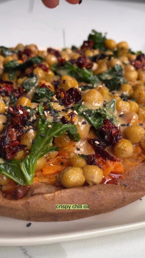 Sweet Potatoes With Tahini Butter Chickpeas The messy mix of tahini, chilli crunch and crispy chickpeas over soft sweet potatoes is divine… | Instagram Sweet Potatoes With Tahini Butter, Sweet Potatoes With Tahini Butter Chickpeas, Tahini Butter, Butter Chickpeas, Veggie Mains, Sweet Potato Hummus, Tahini Recipe, Chilli Oil, Sweet Potato Spinach