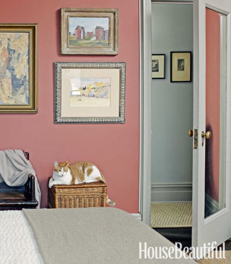 This Manhattan apartment's master bedroom is painted Farrow & Ball Picture Gallery Red and Charleston Gray. Designer Alexander Doherty was inspired by the palette of the galleries' walls at the Metropolitan Museum of Art. Laptop the cat poses beneath a Thomas McKnight streetscape and an anonymous beach scene. Priscilla Alexander painted the abstract portrait over the Chinese chair, as well as the portrait next to the bed. Picture Gallery Red, Colors For Bedrooms, Farrow And Ball Bedroom, Ideas For Bedrooms, Red Earth, Farrow And Ball, Bedroom Color, Inside Design, Bedroom Color Schemes