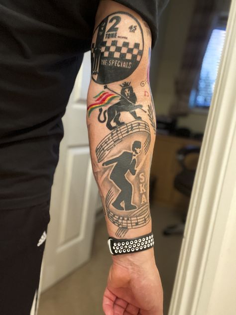 Ska/Reggae inspired tattoo sleeve coming along nicely.  Just added The Specials record label and another Lion of Judah! Ska Tattoo Ideas, Reggae Tattoo Ideas, Madness Tattoo, Skinhead Tattoos, Bob Marley Tattoo, Reggae Art, Ska Music, Skinhead Fashion, Finger Tats