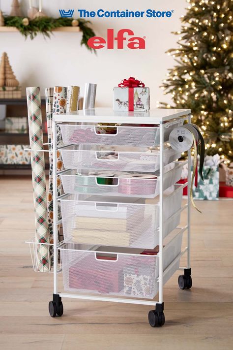 Available only at The Container Store, our exclusive Get ready for holiday wrapping! The Elfa Mesh Gift Wrap Cart is a mobile gift packaging organizer for wrap, totes, tissue, ribbon and accessories. It includes three 1-Runner Mesh Drawers and two 2-Runner Mesh Drawers. The fine weave of the mesh prevents small items from falling through. Clipped to the exterior is a Ribbon Dispenser, Gift Wrap Organizer and Accessory Basket. Container Store Gift Wrap Organizer, Gift Wrapping Cart, Gift Wrap Cart, Wrapping Cart, Ribbon Dispenser, Mesh Drawers, Gift Wrap Organizer, Gift Wrap Organization, Kitchen Drawer Organizers