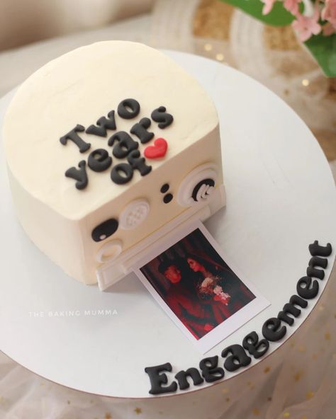 Celebrating two years of love, laughter, and memories! 📸❤️ This custom Polaroid-inspired engagement cake is as unique as your journey together. Mark your milestones with a personalized touch of sweetness! 📲 WhatsApp to order: 7044955912 #EngagementCake #CustomCakes #PolaroidCake #TheBakingMumma #KolkataHomeBaker #CelebrateWithCake #HomeBakerCommunity #CakesOfInstagram Photo Pulling Cake, 25 Anniversary Cake Unique, Anniversary Cake Unique, Cake Designs Anniversary, Unique Anniversary Cake Designs, Cake Polaroid, Polaroid Cake, Engagement Anniversary Cake, Engagement Cake Designs