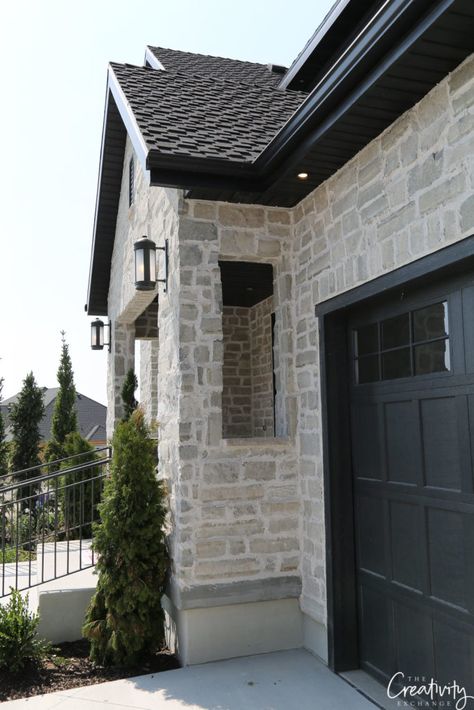 Solid stone exterior. Exterior home trends Grey Wash Exterior Brick, Slurried Stone Exterior, Stone Ideas For Front Of House, Light Brown Home Exterior, Stone Stucco House Exterior, Stucco With Stone Exterior, Stone Bottom Of House, House Stone Exterior Ideas, Stone On Front Of House